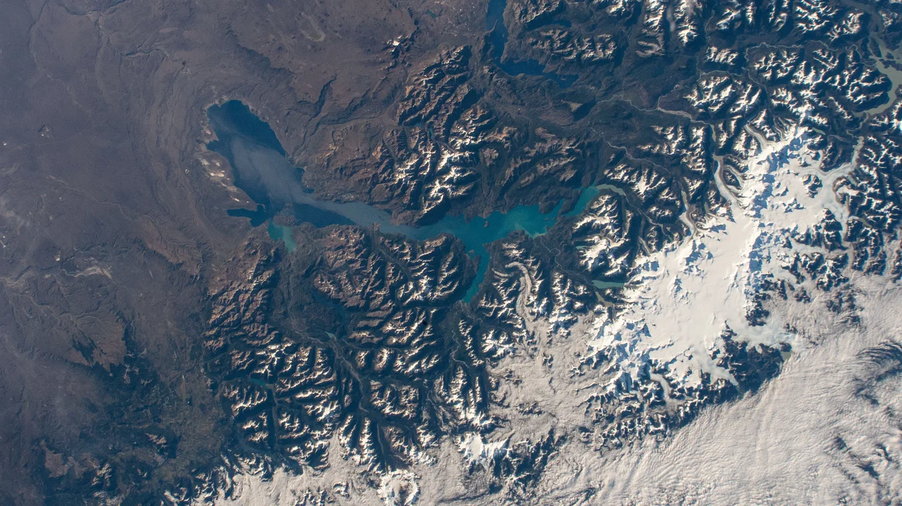 iss064e029029 (Feb. 2, 2021) --- Laguna San Rafael National Park comprises General Carrera Lake and the snow-capped peaks of the Andes in this picture from the International Space Station as it orbited 270 miles above southern Chile in South America. Glaciers, Northern Patagonian Ice Field