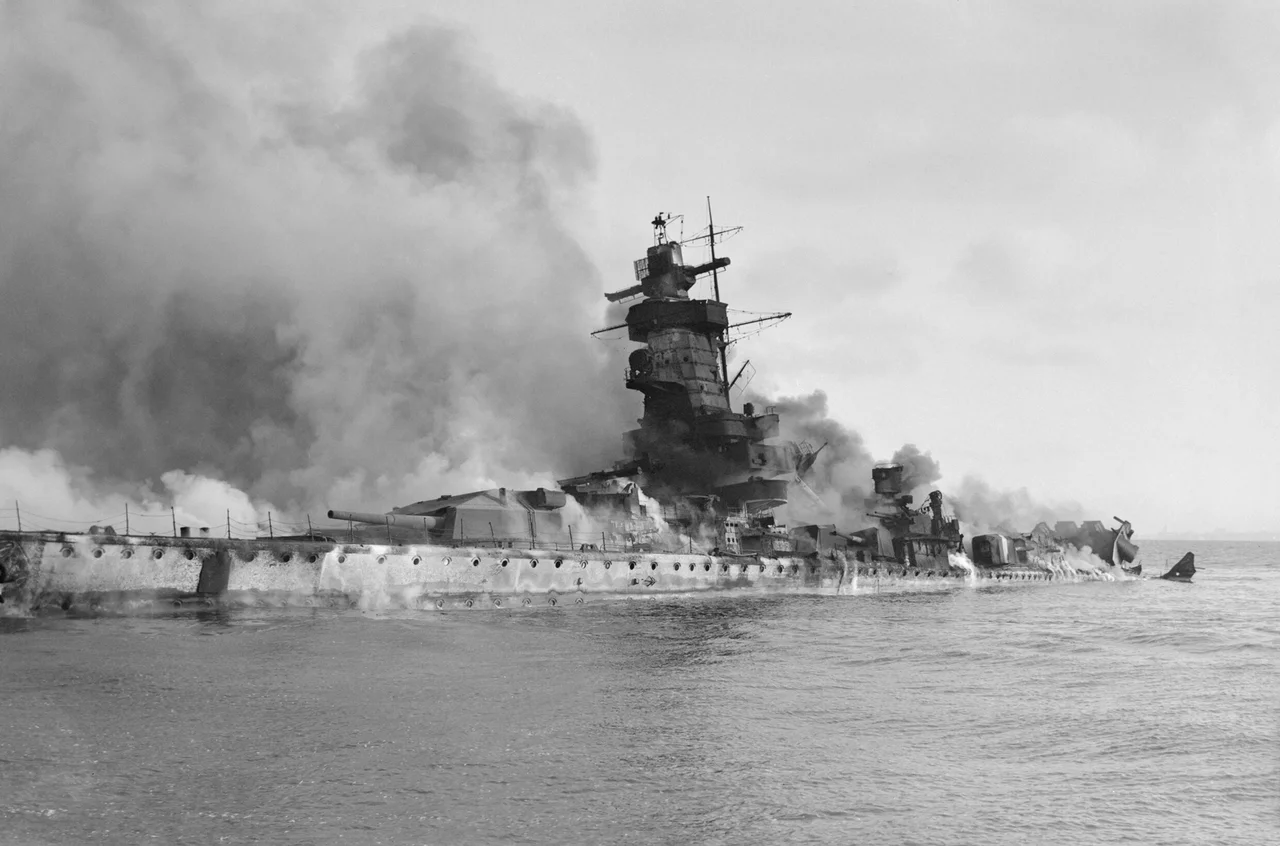 IWM caption : The German battleship Admiral Graf Spee in flames after being scuttled in the River Plate Estuary off Montevideo, Uruguay.