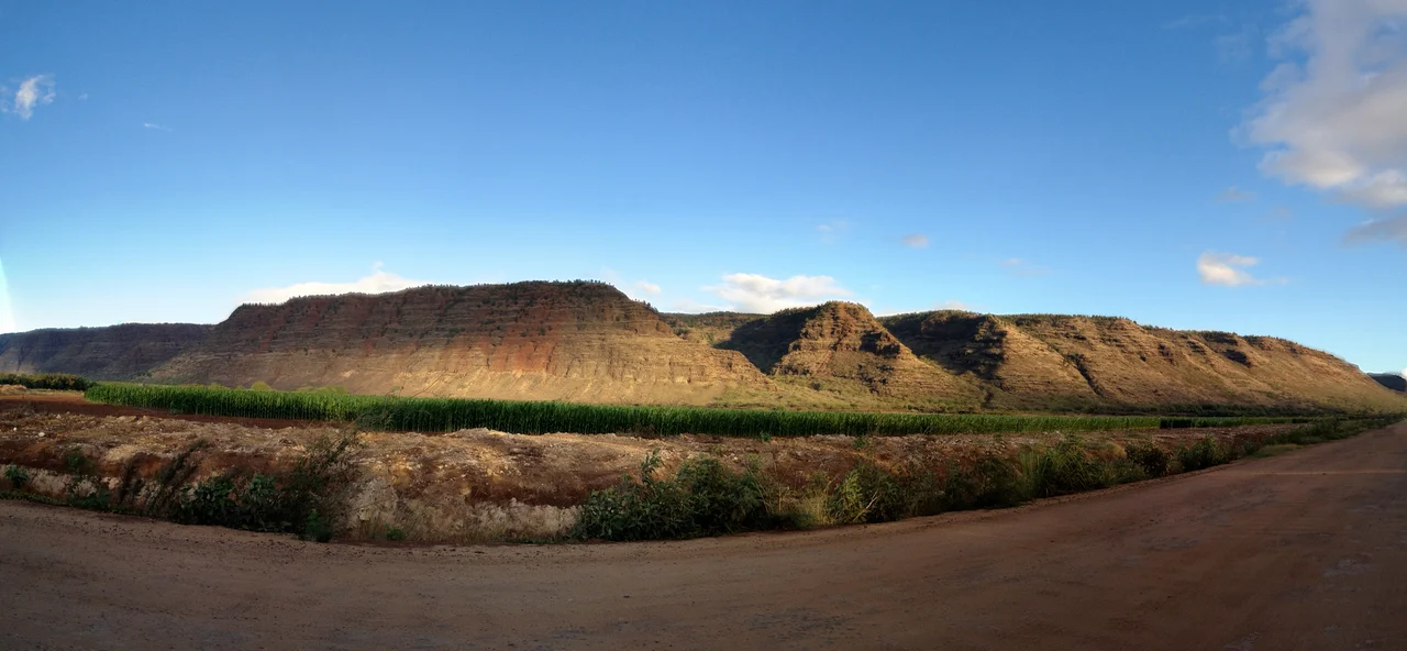 A panoramic view of the ridge enclosing ‘Ohai‘ula Valley, at the western end of the island of Kauai, Hawaii, as seen from the road to Polihale State Park.