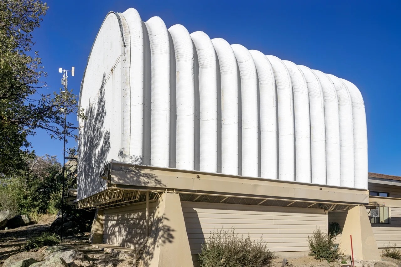 The enclosure University of Arizona's SUPERLOTIS 0.6-meter telescope, located at the Kitt Peak National Observatory in Arizona, is shown here.