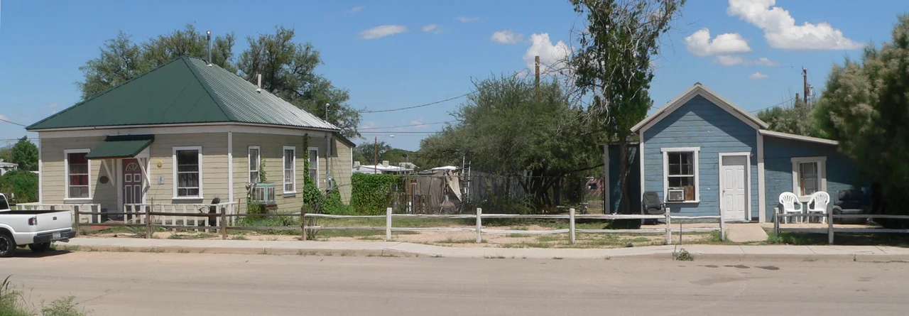 Houses at 201 (left=west) and 223 (right=west) E. 3rd Street in Benson, Arizona. The houses are part of the Benson Railroad Historic District, listed in the National Register of Historic Places.