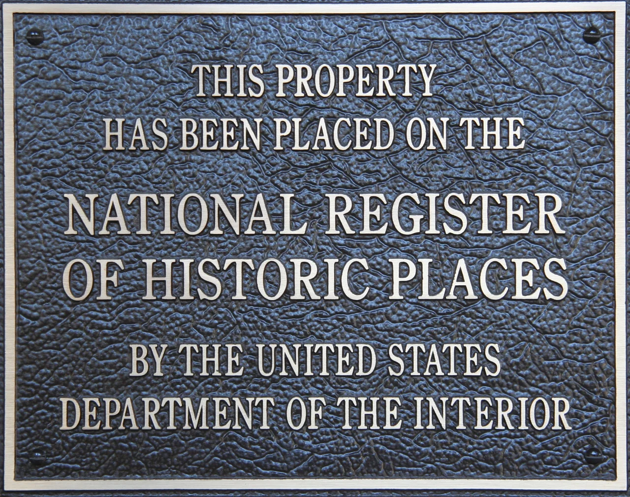 Plaque declaring "this property has been placed on the National Register of Historic Places by the United States Department of the Interior"