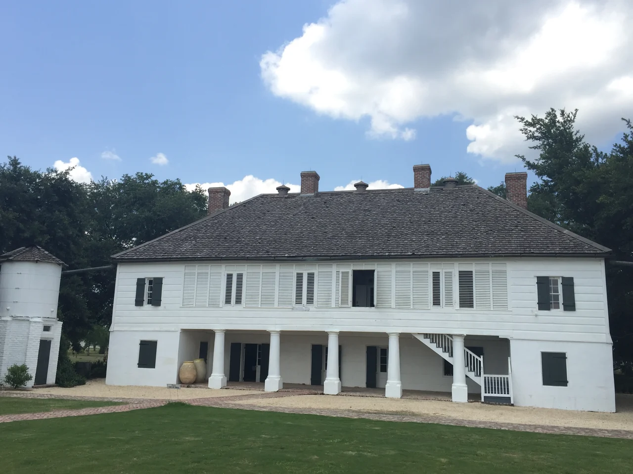 The Big House. Raised French Creole style cottage was built of masonry and cypress in the late 18th century. It is one of the earliest and best preserved Creole plantation houses standing on River Road. Sometime prior to 1815, the Big House was expanded to its present configuration with seven rooms on each level, plus a full-length gallery across the front and an open loggia facing the rear. This is also one of the very few historic American houses known to have received decorative wall paintings on both its exterior and interior.