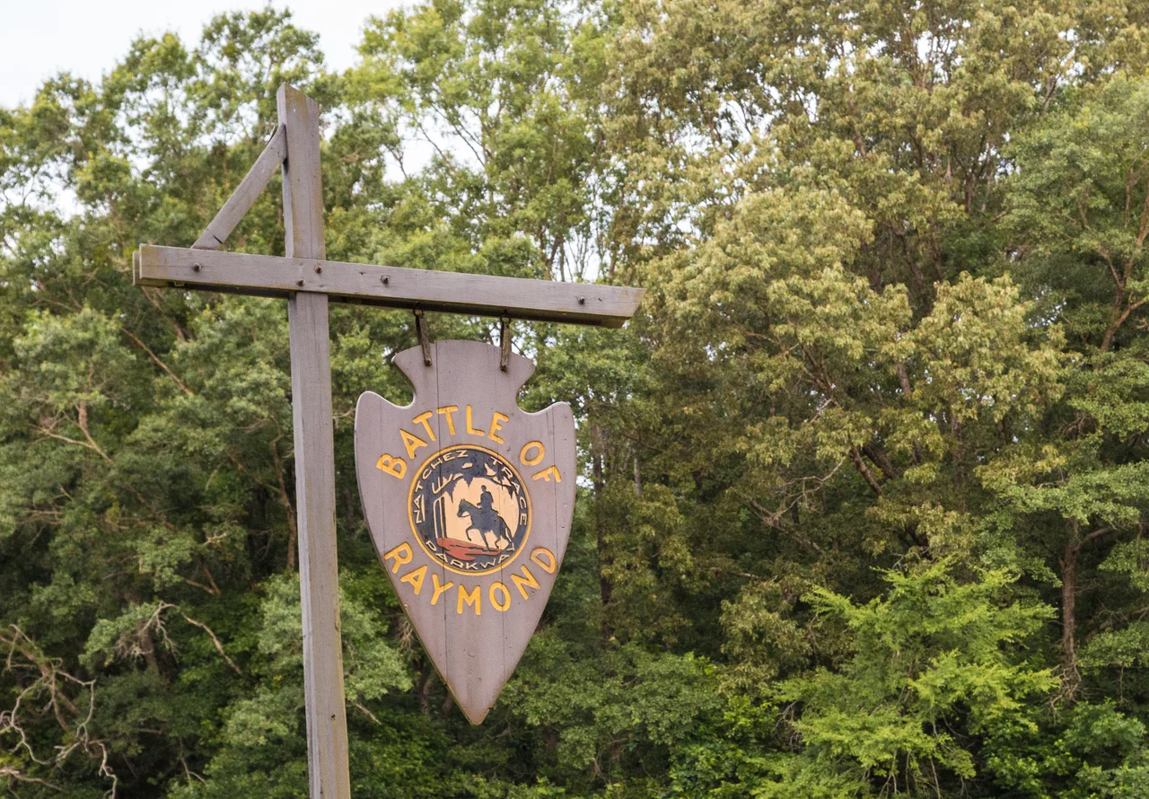 A sign for the Battle of Raymond historic site on the Natchez Trace Parkway near Raymond, Mississippi.