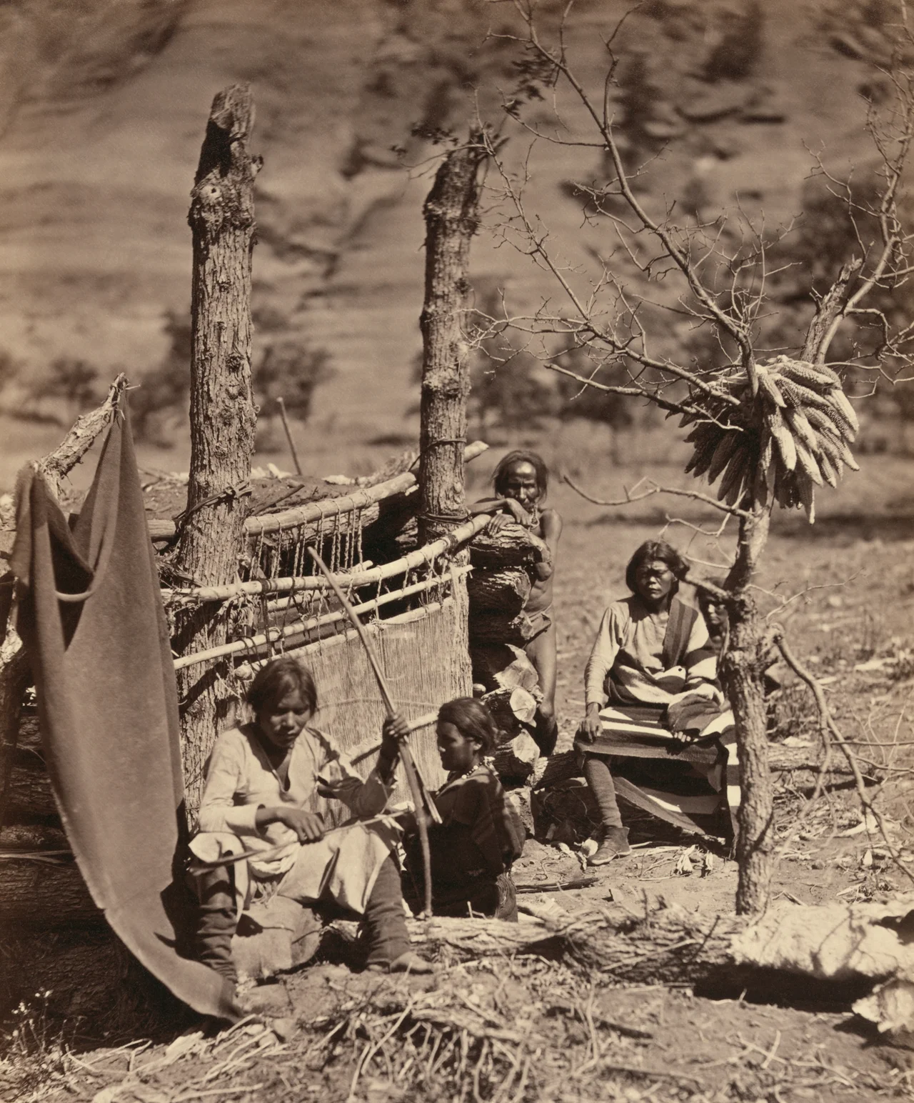 Vintage albumen print.  Original caption "Aboriginal life among the Navajoe Indians. Near old Fort Defiance, N.M. / T. H."