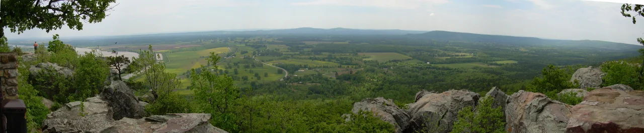 Panoramic view from Petit Jean Mountain, the Arkansas River can be seen on the left. The alleged grave of "Petit Jean" is immediately below the foreground.