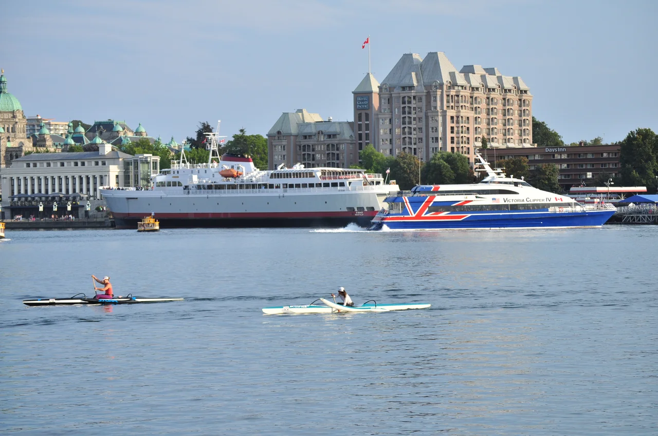 CPR Steamship Terminal, Victoria, British Columbia,  Black Ball Line's M/V Coho (which does the run from Victoria to Port Angeles, Washington), and Victoria Clipper IV (which does the run to Seattle) seen from the Delta Victoria Ocean Pointe across the Inner Harbour.