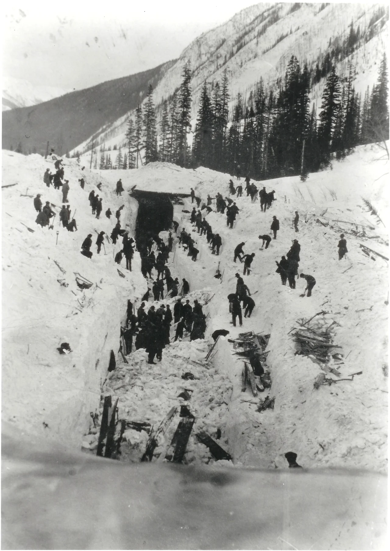 The aftermath of the 5 March 1910 avalanche at snow shed 14 in Rogers Pass, British Columbia, Canada. Not to be confused with the fatal slide a day earlier at shed 17: Fifty-eight men died in what is still the nation's worst avalanche disaster.