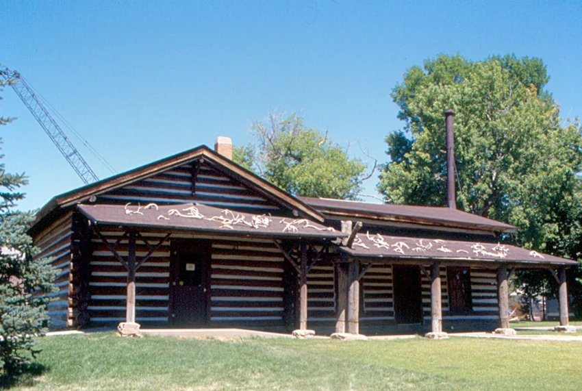 "Charles M. Russell (1864-1926) was a painter of Western scenes of the U.S.  These included cownboys and other white settlers, Indians, and landscapes.  He created over 2,000 paintings.  He lived most of his adult life in Great Falls, Montana.  The C. M. Russell Museum has the largest collection of his works.  

I believe that the objects on the roof are elk antlers.  Russell's home / studio was moved to a location next to the museum."