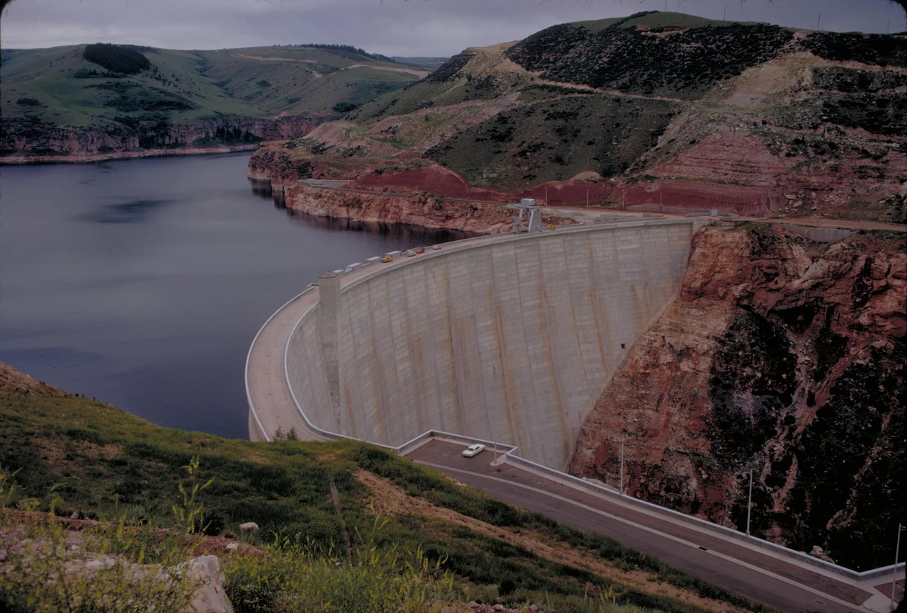 Yellowtail Dam
Bighorn Canyon National Recreation Area was established by an act of Congress on October 15, 1966, following the construction of the Yellowtail Dam by the Bureau of Reclamation. This dam, named after the famous Crow chairman Robert Yellowtail, harnessed the waters of the Bighorn River and turned this variable stream into a magnificent lake.
Bighorn Lake extends approximately 60 miles through Wyoming and Montana, 55 miles of which are held within spectacular Bighorn Canyon. The Recreation Area is composed of 70,000+ acres, which straddles the northern Wyoming and southern Montana borders. There are two visitor centers and other developed facilities in Fort Smith, Montana and near Lovell, Wyoming. The Afterbay Lake below the Yellowtail Dam is a good spot for trout fishing and wildlife viewing for ducks, geese and other animals. The Bighorn River below the Afterbay Dam is a world class trout fishing area.
Keywords: bica; Recreation areas; National parks and reserves; Canyons; Lakes