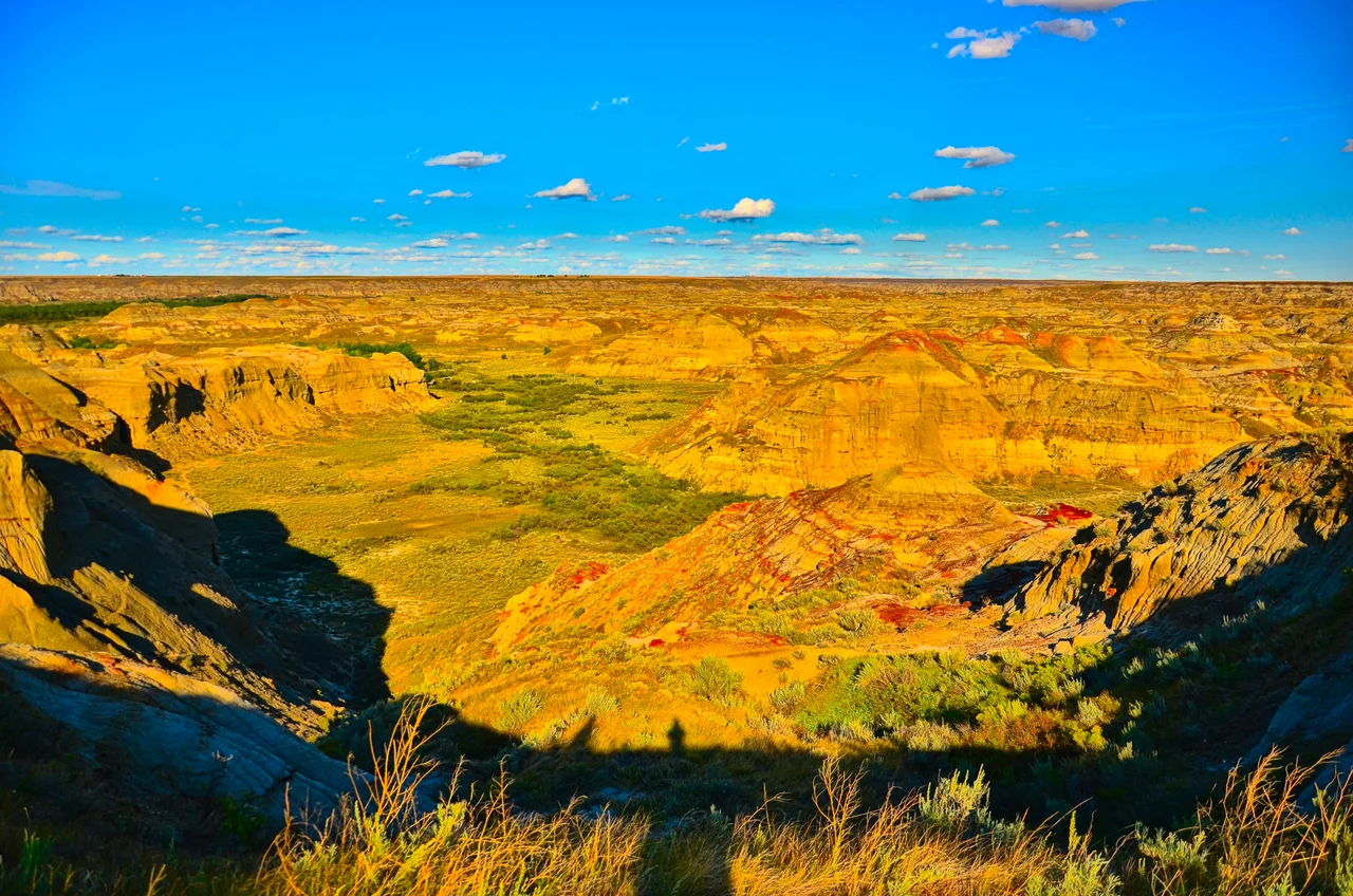A rugged Red Deer River valley landscape, as viewed from an overlook point just before sunset in Dinosaur Provincial Park, Alberta.