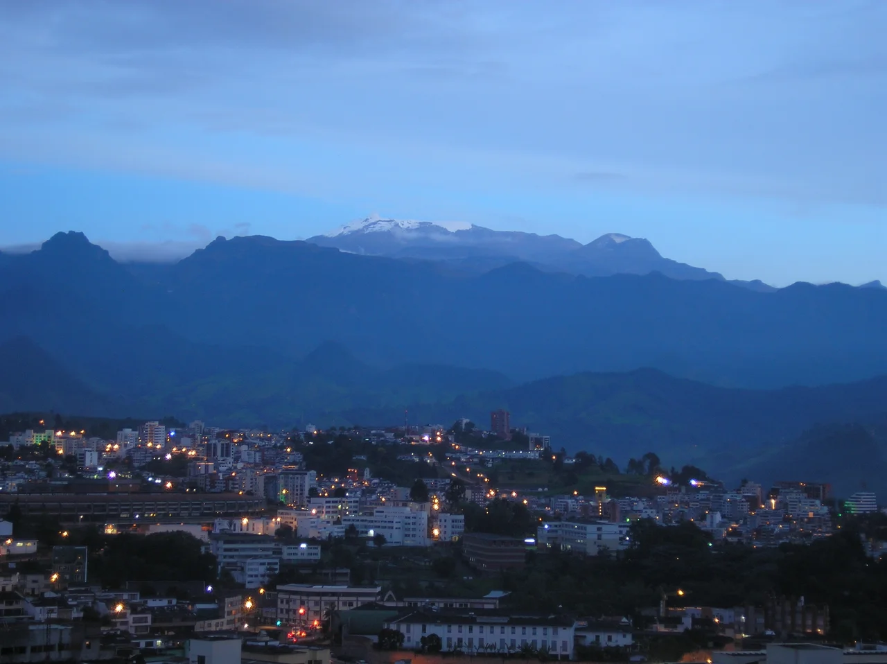 "Nevado del Ruiz" (El Ruiz snow peak). Part of Los Nevados National Park. I took this picture on December 27, 2006 at around 6:30 pm local time, from Manizales. 20 years ago, snow used to cover the mountain peak and the "La Olleta" volcano. The top left of the mountain is showing signs of activity coming from the Arenas crater, which points to the other side (eastward) of Los Andes mountain range. This crater exploded in 1985, causing a lahar that buried the 25.000-people city of Armero in the middle of the night. Still, the Nevado del Ruiz remains one of the most beautiful natural attractions, not only in Manizales, but Colombia.