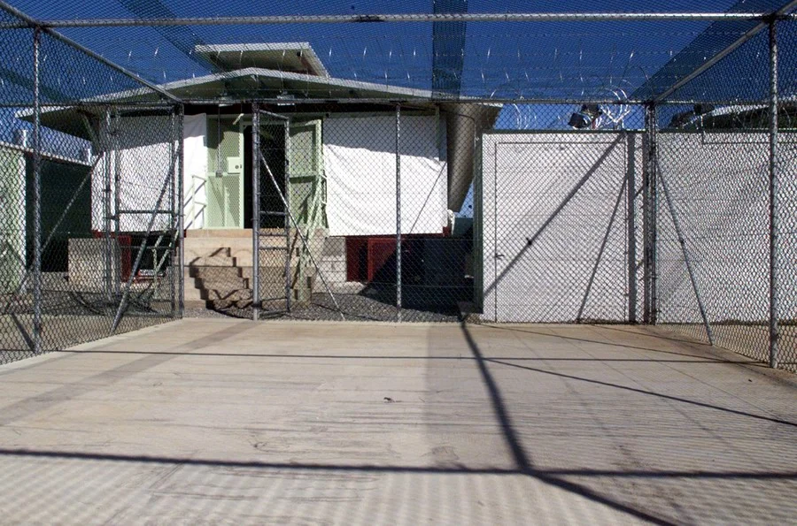 Original caption reads:

"A Camp Delta recreation and exercise area at Guantanamo Bay, Cuba. The detention block is shown with sunshades drawn on December 3, 2002. DoD photo by Staff Sgt. Stephen Lewald, U.S. Army. (Released)"
from...

source