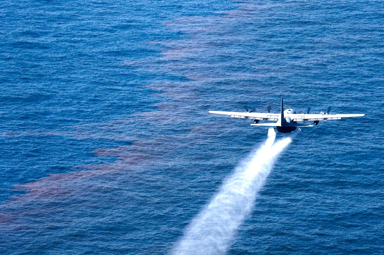 A C-130 Hercules from the Air Force Reserve Command's 910th Airlift Wing at Youngstown-Warren Air Reserve Station, Ohio, drops an oil-dispersing chemical into the Gulf of Mexico May 5, 2010, as part of the Deepwater Horizon Response effort. The 910th AW specializes in aerial spray and is the Department of Defense's only large-area, fixed-wing aerial spray unit.