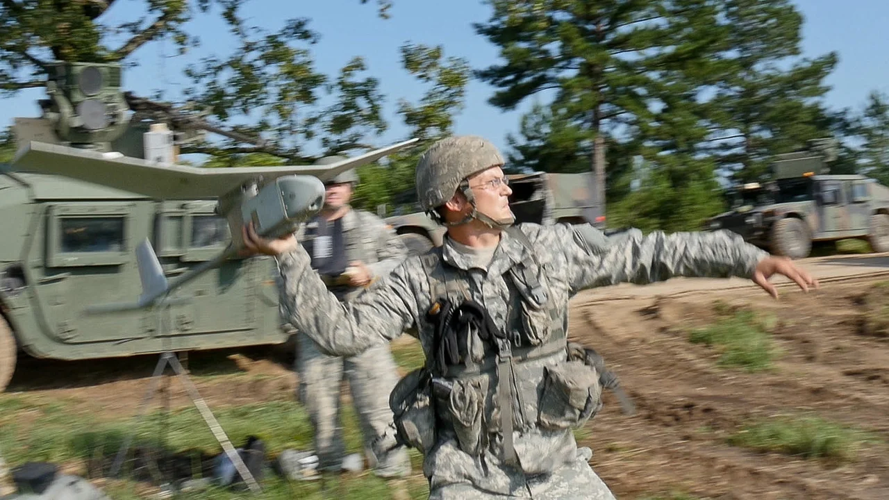 Sgt. Kevin Hall, assigned to Troop C, 1st Squadron 98th Cavalry Regiment, Mississippi Army National Guard, launches an RQ-11 Raven unmanned aerial vehicle during an Exportable Combat Training Capability exercise at Camp Shelby Joint Force Training Center, Miss., July 31, 2015. The XCTC aims to expose National Guard Soldiers to combat-training experiences needed to support Army commitments worldwide. (Mississippi National Guard photo by Sgt. 1st Class Bill Valentine, 102nd Public Affairs Detachment/Released)