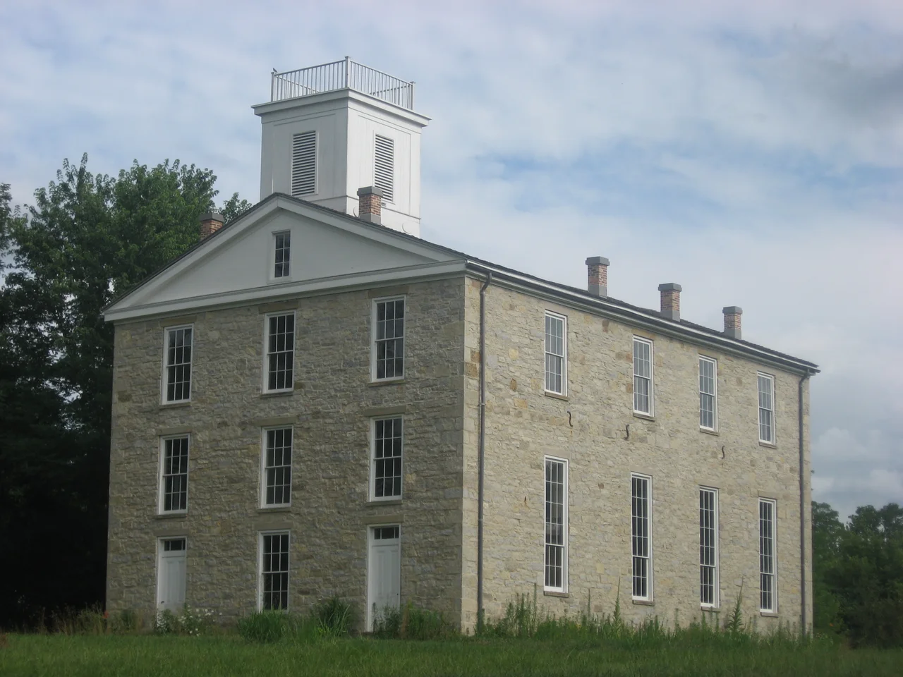 Front and western side of the surviving main building from Eleutherian College, located at 6927 State Road 250 at Lancaster in Lancaster Township, Jefferson County, Indiana, United States.  Built in 1856, the building was used as a public school and community center after the college's closure in the 1880s.  Now a museum, it has been declared a National Historic Landmark.