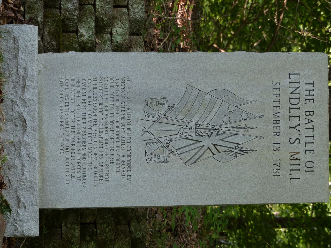 Taken at 35° 53.343′ N, 79° 20.596′ W.  An image of one of three memorial stones for the Battle of Lindley's Mill.