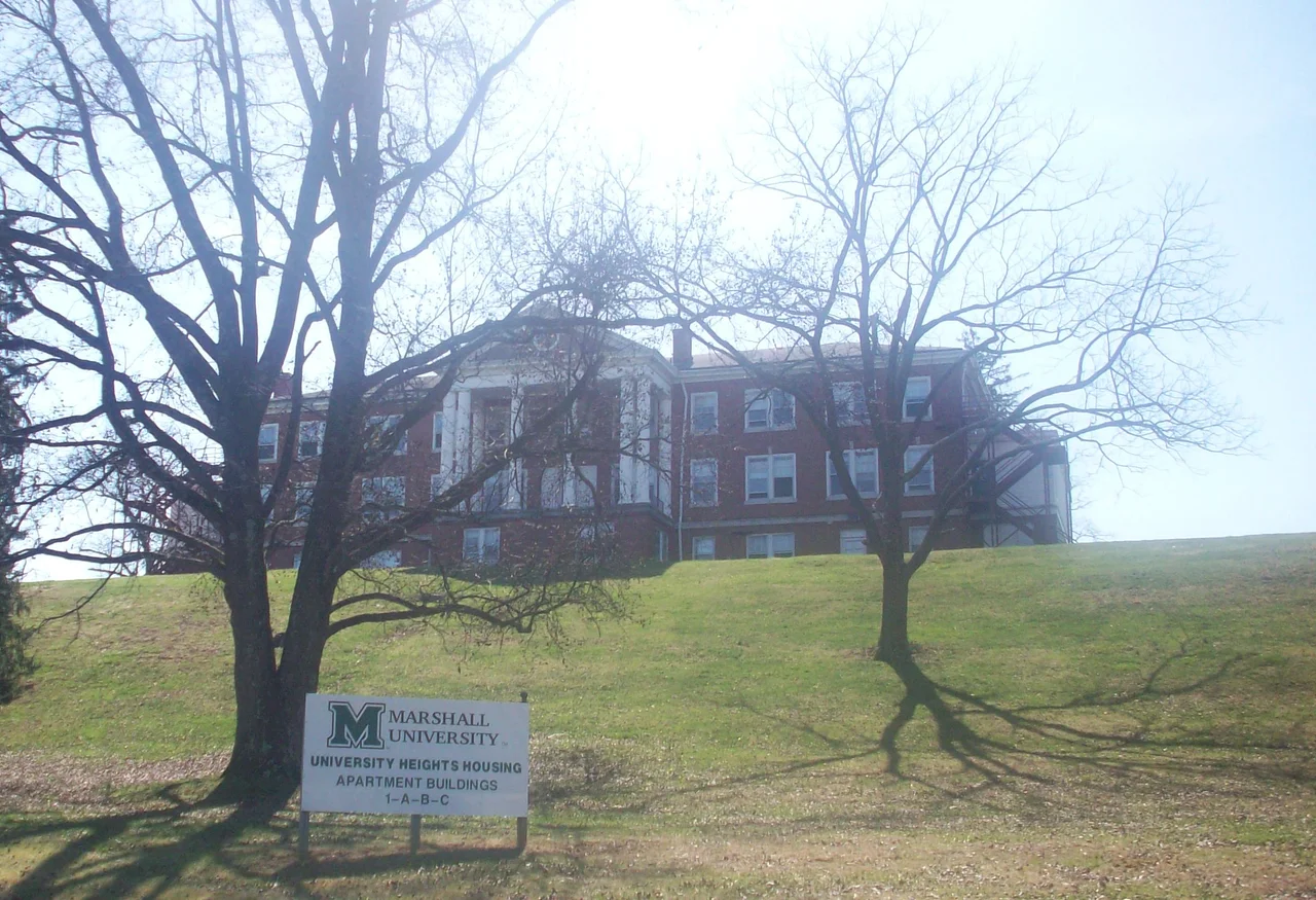 Photo of the University Heights building located in Huntington, West Virginia. The photo was taken from the base of the hill along the road connecting the complex to US Route 60. The site was once the West Virginia Colored Children's Home (a segregation-era orphanage for African American children) and apartments for Marshall University students. Pending litigation, the area will either be a middle school or a drug treatment facility in the future.