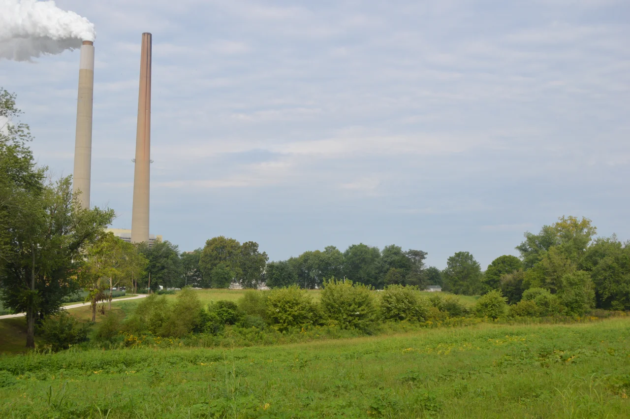 Fields on the western side of State Route 681 just northwest of Darwin in Sutton Township, Meigs County, Ohio, United States. In the background are the chimneys of the AEP Mountaineer Power Plant in Mason County, West Virginia.