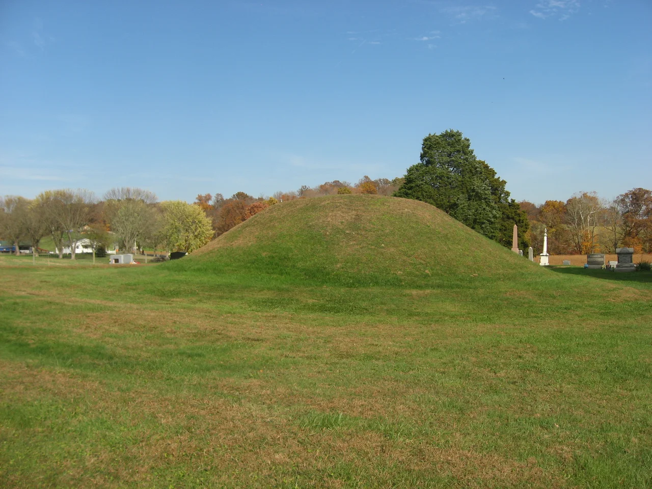 View from the west of the Mound Cemetery Mound, located in Mound Cemetery along County Road 36 north of Chester in Chester Township, Meigs County, Ohio, United States.  Built by the prehistoric Adena culture, the mound is an archaeological site and is listed on the National Register of Historic Places.