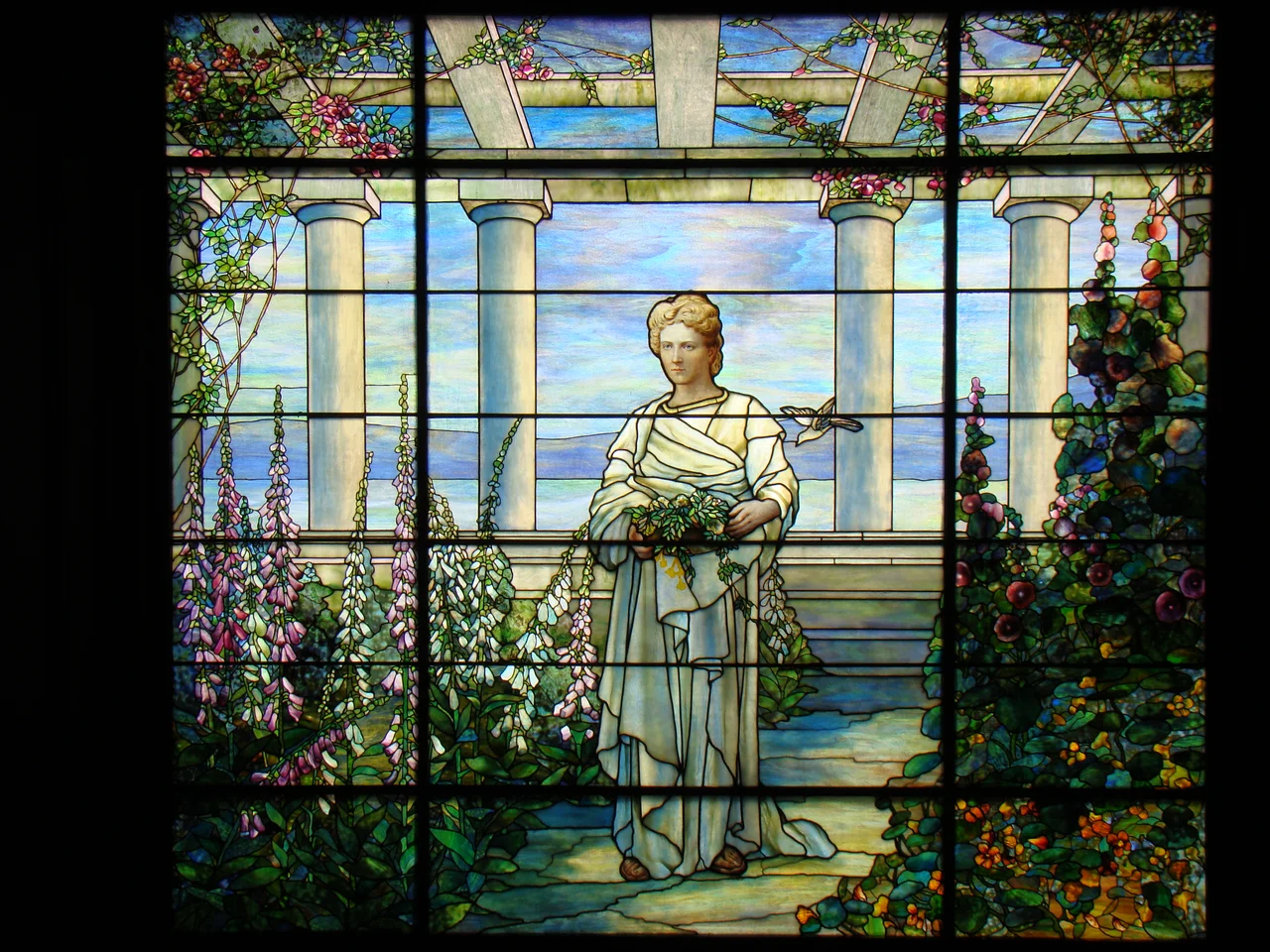 Large stained glass window at main staircase landing at Swannanoa Mansion on Afton Mountain in Nelson County, Virginia. It is aprox 12 feet wide.