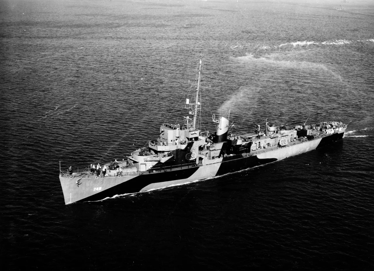 The U.S. Navy destroyer escort USS Tills (DE-748) underway off San Pedro, California (USA), on 11 October 1944. She is painted in Camouflage Measure 31, Design 10D.