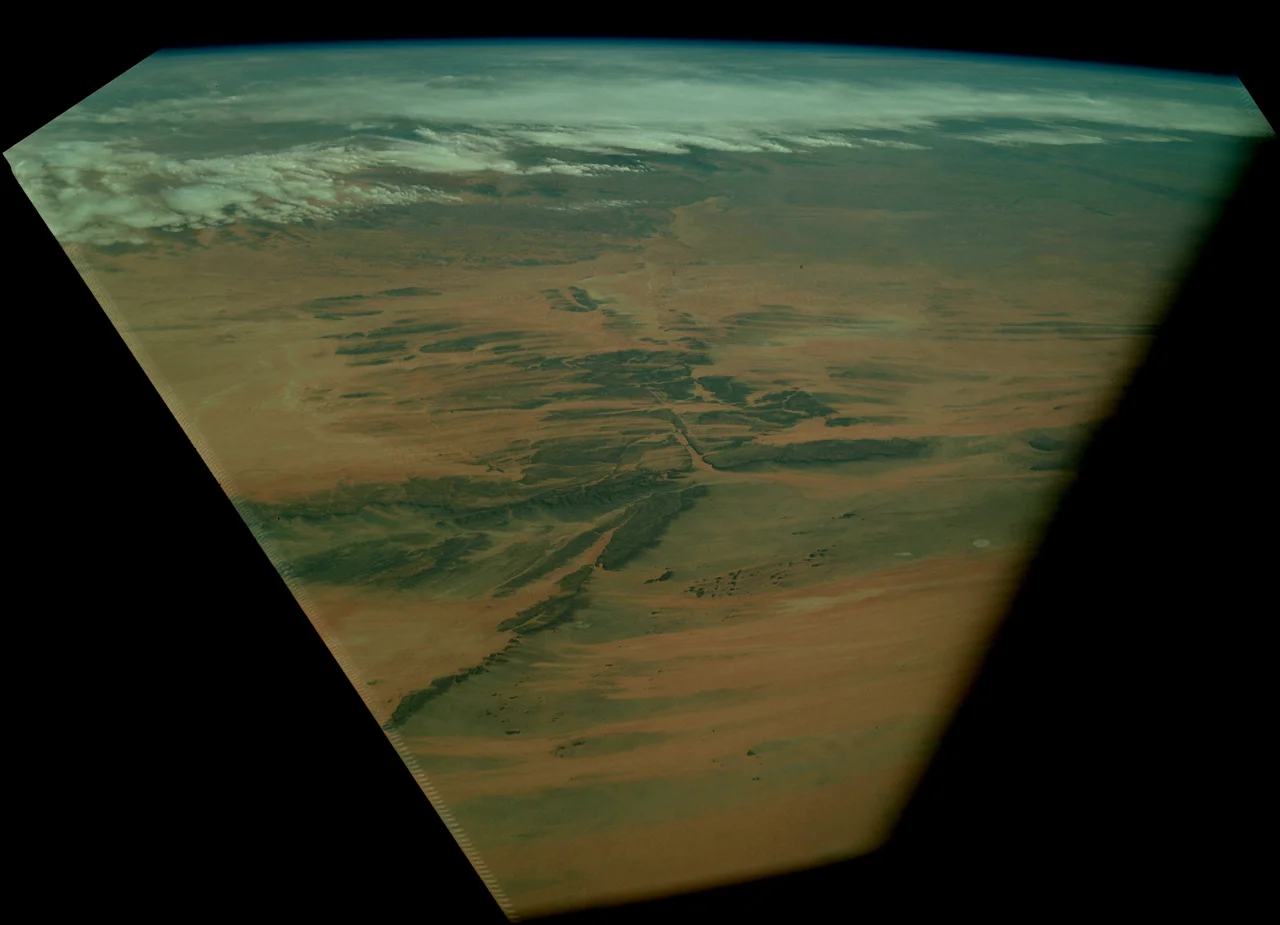 Dhar Adrar Mountains of Mauritania, viewed by Apollo 9 from orbit. Rotated and cropped, then brightness and contrast adjusted from original.