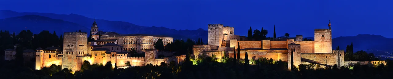 Evening panorama of Alhambra from Mirador de San Nicolás, Granada, Spain.