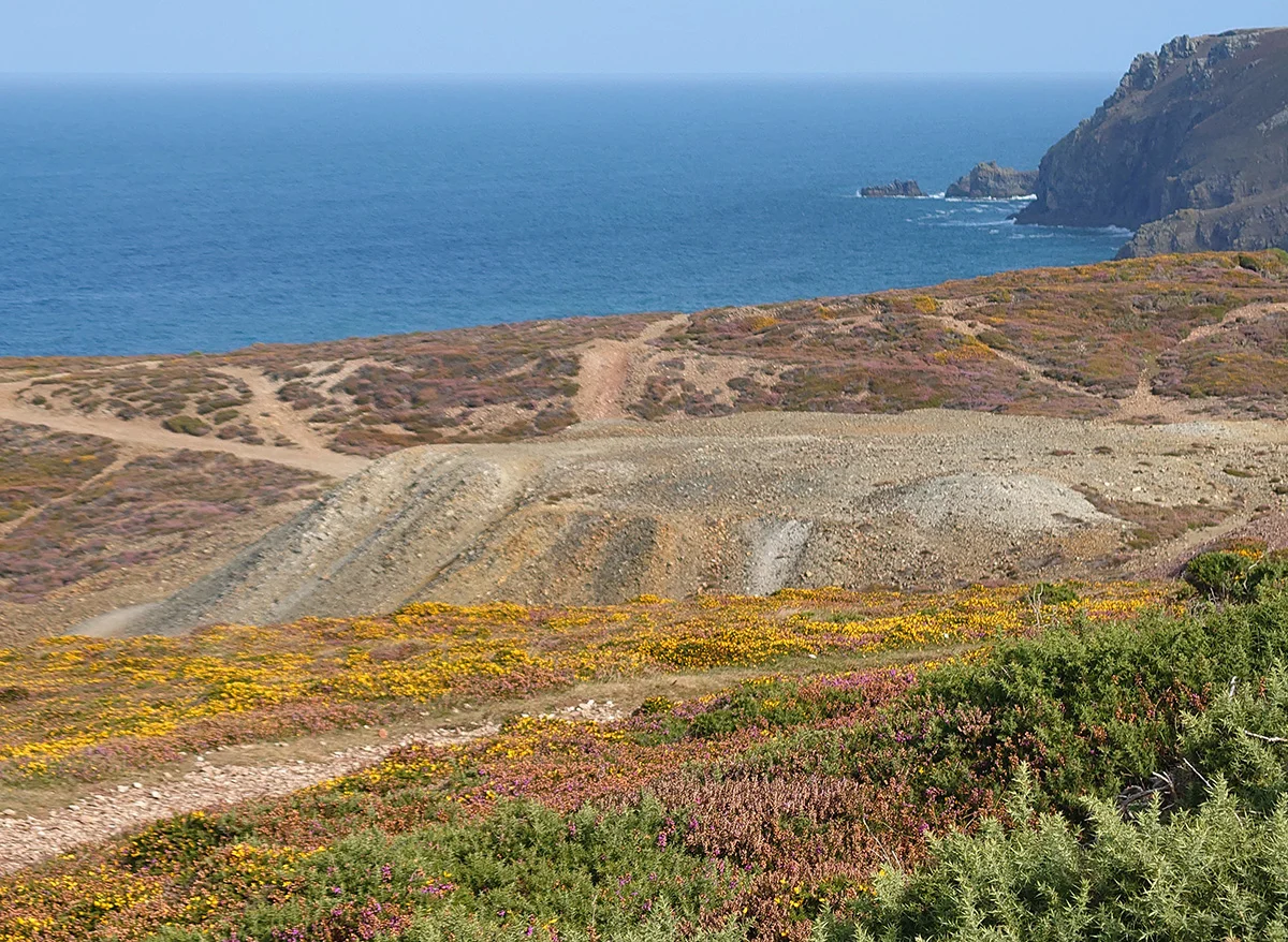 Spoil tips to the west of Great Wheal Charlotte mine, looking northwestwards from near the one remaining wall of the mine buildings. The area is crisscrossed with paths belonging to the National Trust and is on the route of the South West Coast path.