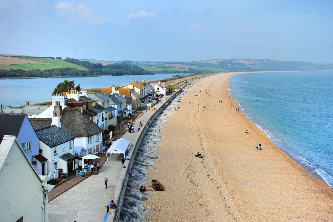 Torcross in the South Hams of Devon, England. The beach is Slapton Sands, and behind the houses can be seen the freshwater Slapton Ley, a site of special scientific interest.