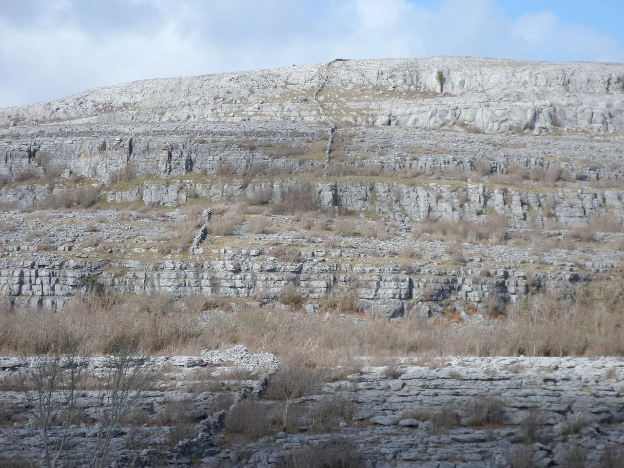 A yet unknown mountain in The Burren. Note the wall going up straight to the top of the mountain.