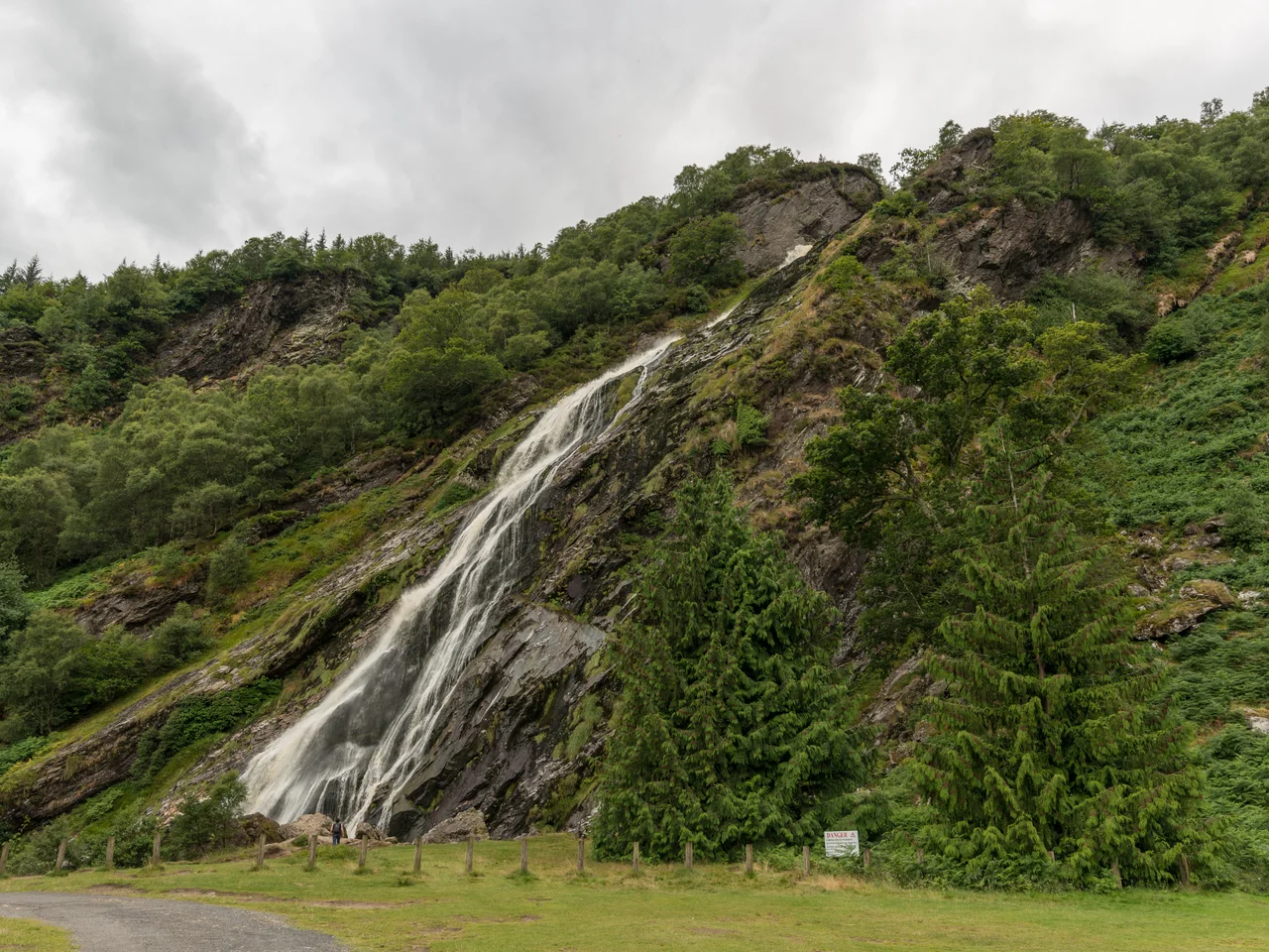 View of Powerscourt Deerpark and Waterfall at Ride Rock, Crone Woods near Enniskerry, County Wicklow, Ireland. At 121 metres, the waterfall is the tallest in Ireland. It is fed by the River Dargle which rises in the Glensoulan valley near Djouce mountain, which can be seen in background.