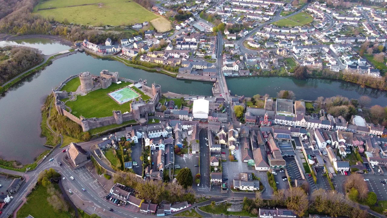 Aerial view of Pembroke Castle and Main Street in Pembrokeshire, Wales, UK on 18 April 2021.