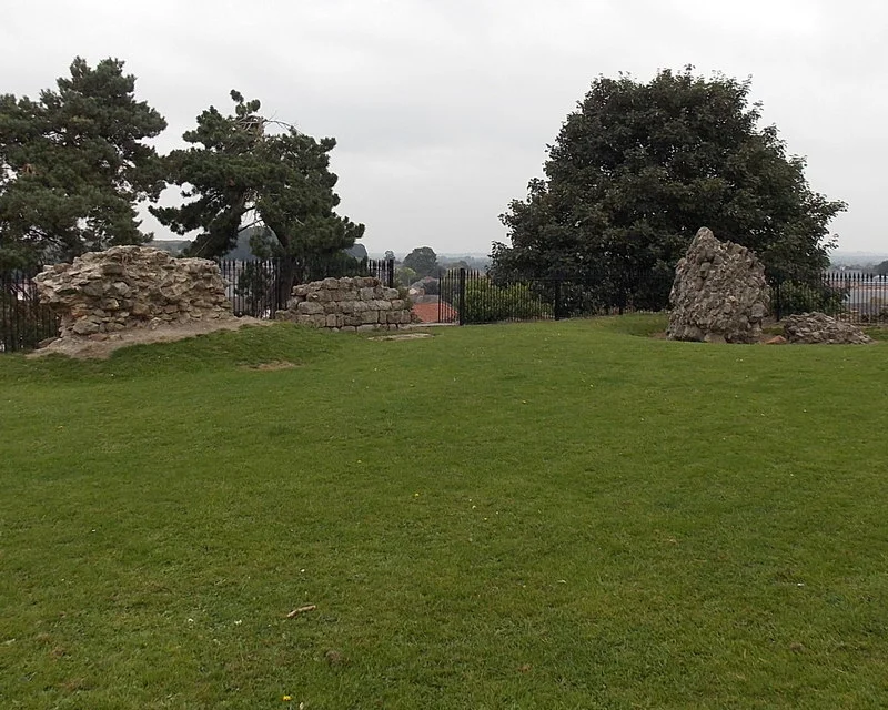 Fragmentary remains of Oswestry Castle
A few fragments of 13th century masonry remain on top of a late 11th century motte. The castle was razed in 1644 by Parliamentarian forces during the Civil War. The remains are Grade II listed and a Scheduled Ancient Monument.