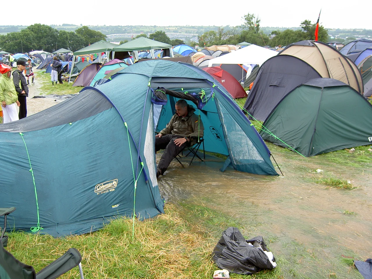 Glastonbury Festival 2005, a river runs through one unfortunate punter's tent after two inches of rain were dropped in an hour on Friday morning.
