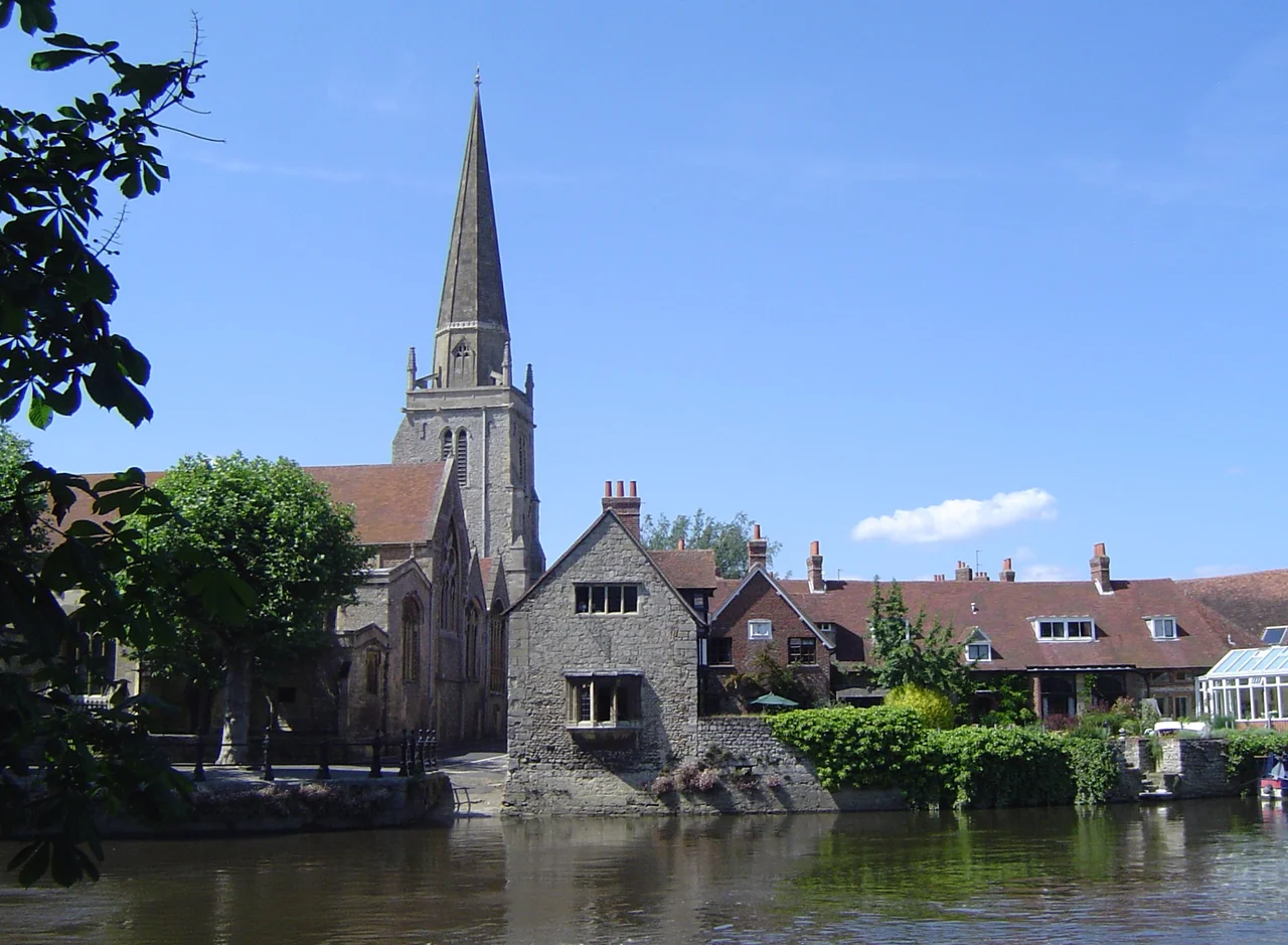 River Thames at Abingdon, Oxfordshire (formerly Berkshire), with the Church of England parish church of St Helen and its 13th century steeple in the background