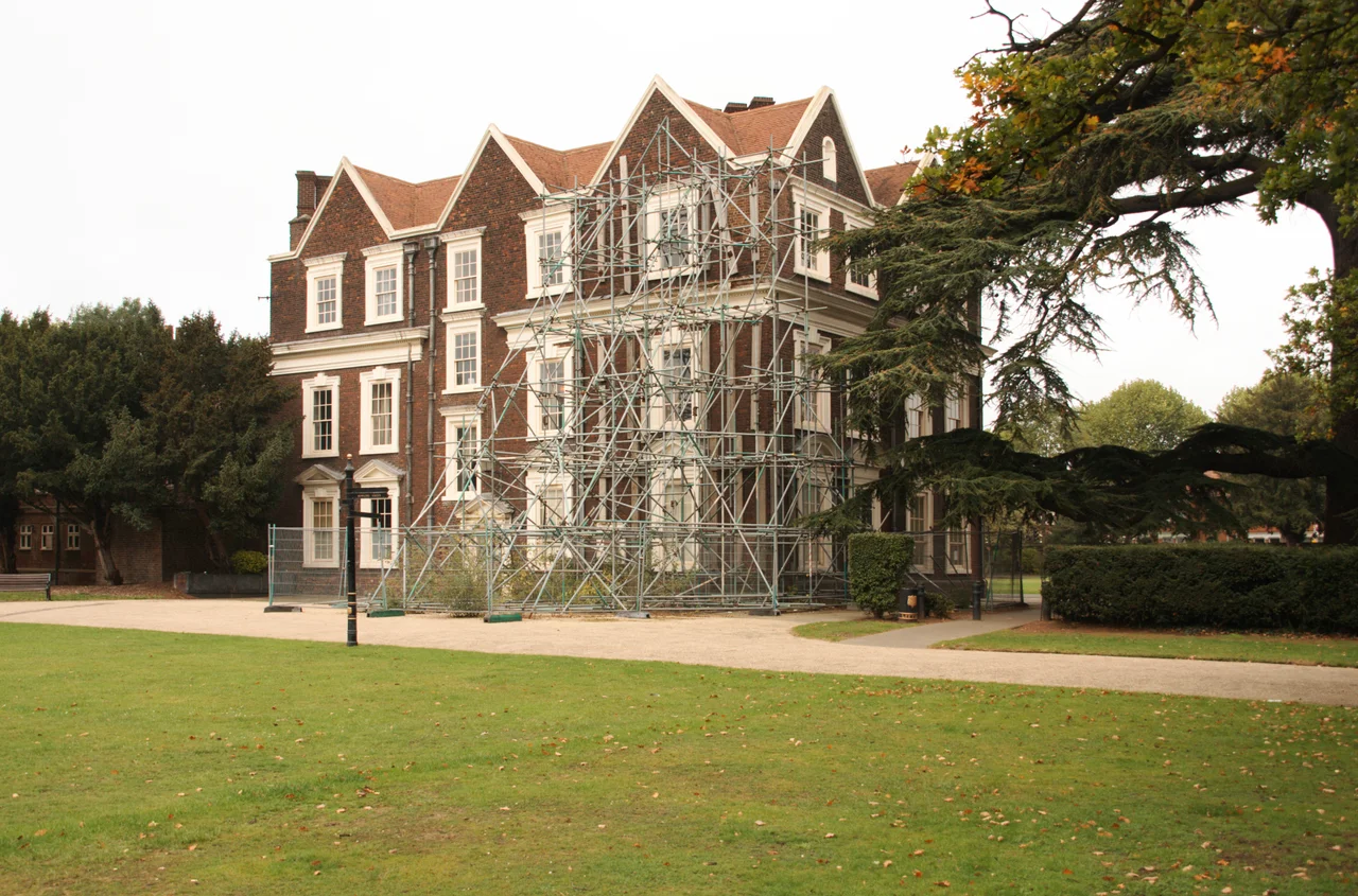 Boston Manor House, south west corner with its long term 'temporary' supporting scaffolding.     Currently on the English Heritage at Risk Register.  Basic repair work to this building estimated to cost a minimum of £1.3M. Owners pursuing possible future options for use.