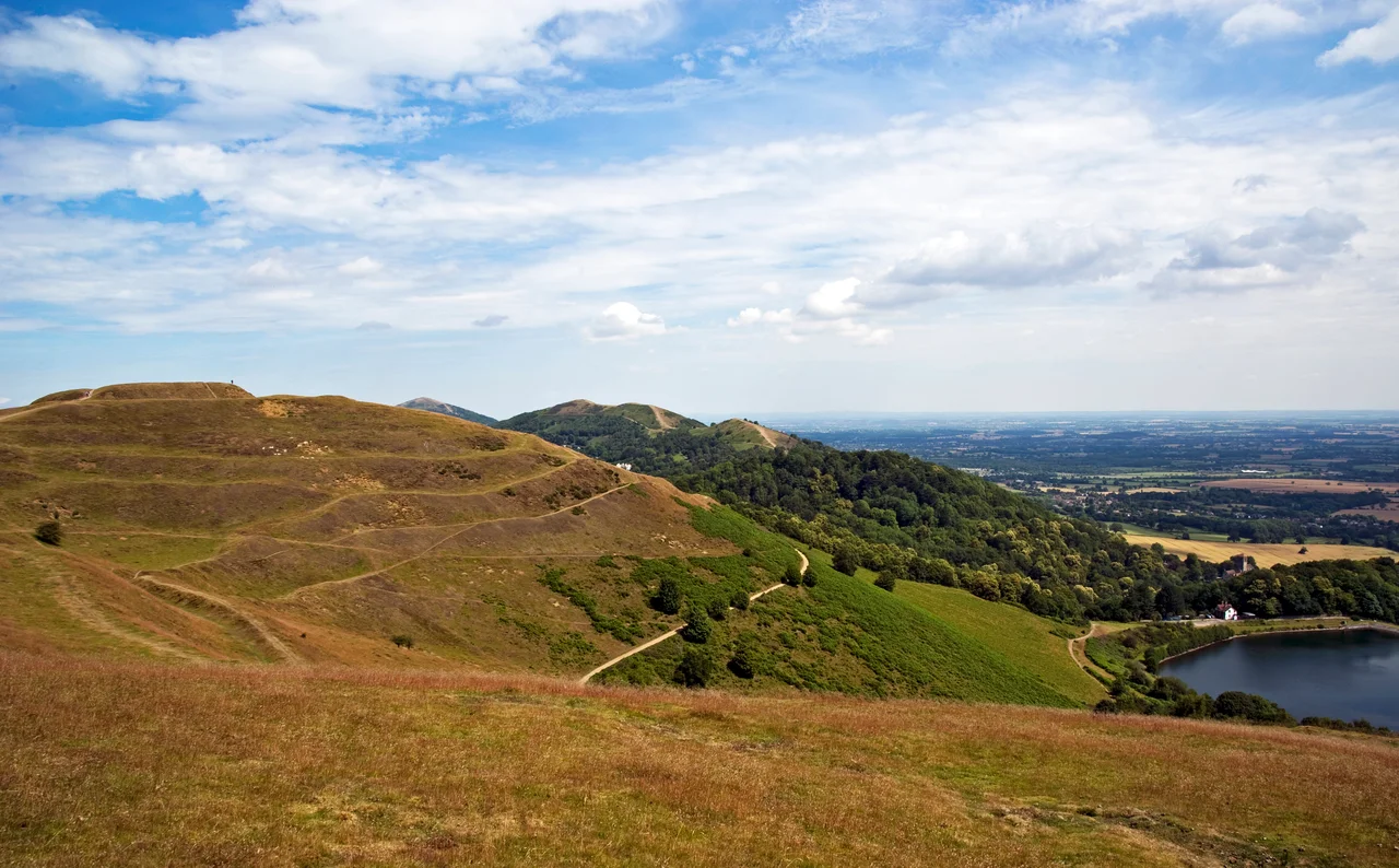 The British Camp is an Iron Age hill fort located at the top of Herefordshire Beacon in the Malvern Hills. The fort is thought to have been first constructed in the 2nd century BC. The extensive earthworks remain clearly visible today and determine the shape of the hill.