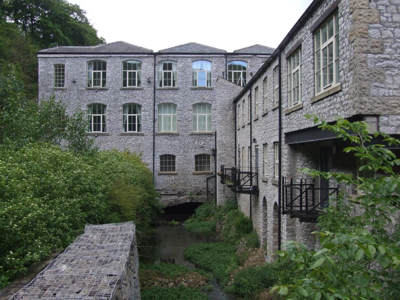 Litton Mill is a small hamlet built round a former cotton mill, in Millers Dale, on the River Wye near
Bakewell in the Derbyshire Peak District in the United Kingdom. 
The mill from downstream showing the tail race.


Camera location53° 15′ 12.24″ N, 1° 45′ 34.92″ W View this and other nearby images on: OpenStreetMap 53.253400;   -1.759700