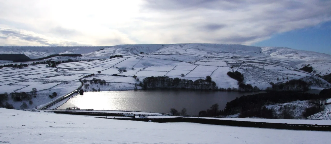 View of Digley Reservoir and Holme Moss radio transmitter at Holme, West Yorkshire. Bilberry reservoir, just visible to the right, collapsed in 1852 causing the Holmfirth Flood
