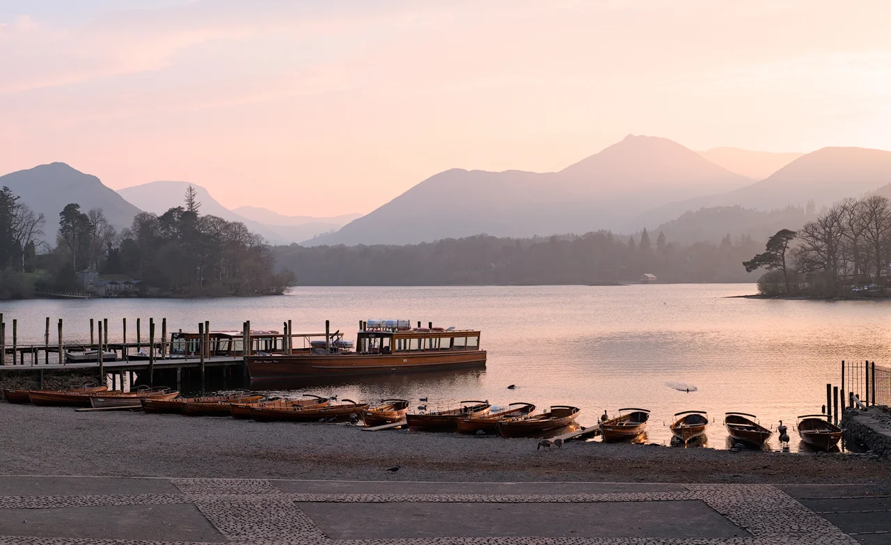 Keswick ferry terminal on the Derwentwater during golden hour (Cumbria County, Lake District National Park, England)