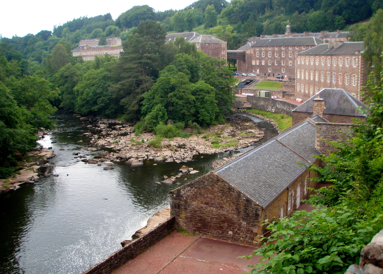The village of New Lanark with its associated mill buildings and the river in the foreground
