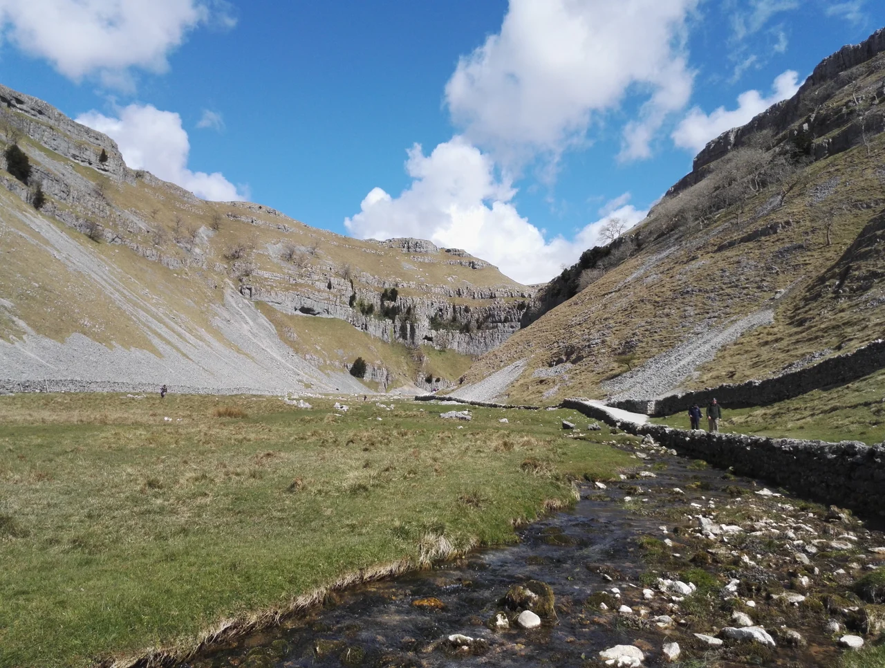 The valley on the approach to Gordale Scar in North Yorkshire, England. The Gordale Beck flows through the valley.