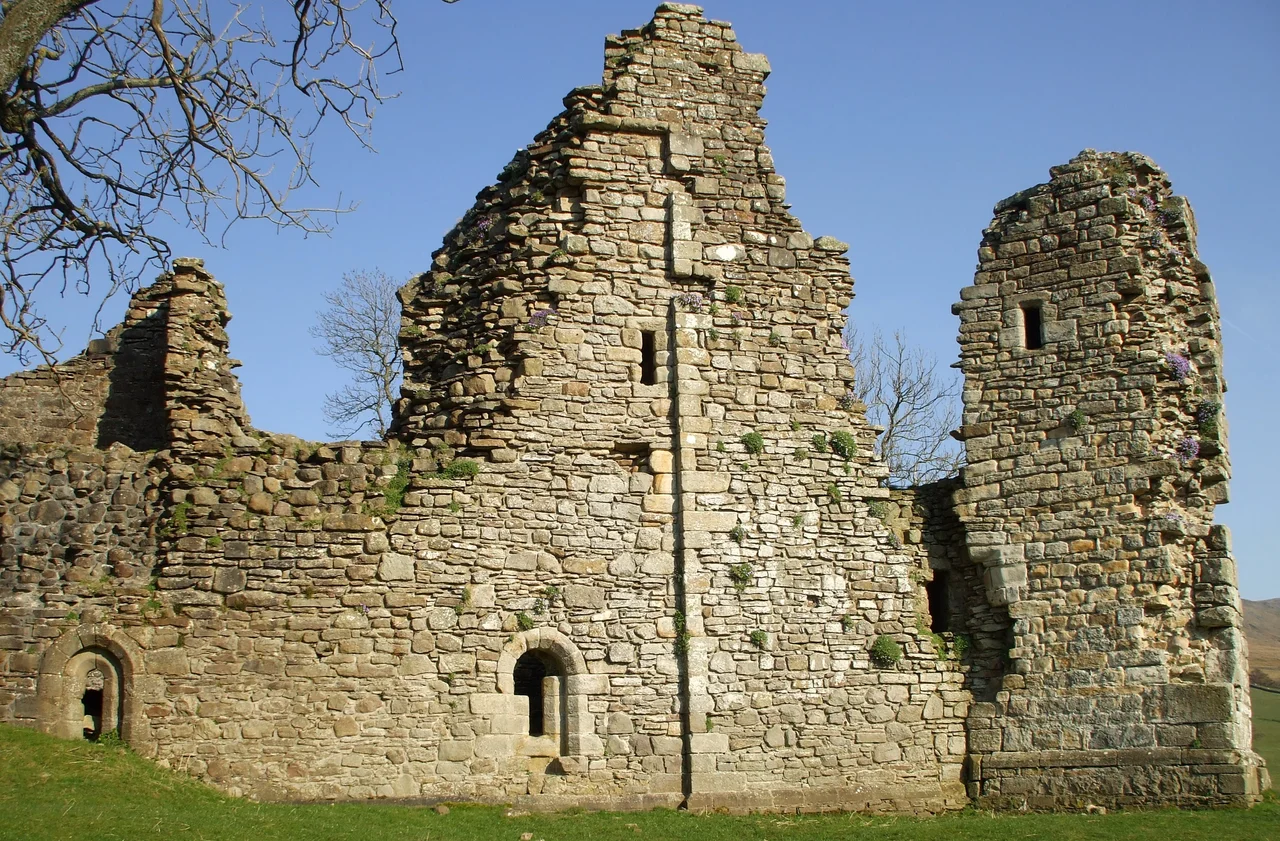 West wall of Pendragon Castle Built as a Late Norman pele tower. It was burnt by the Scots in 1541, but was restored by Lady Anne Clifford in 1660; however by the mid 18thC it had become  a ruin again.