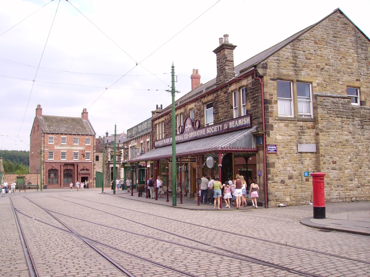 Beamish Museum, County Durham, England. This is the east end of the main street in Town, showing the bank at the end of the street, and the motor showroom/garage & Co-Op general store on the south side.