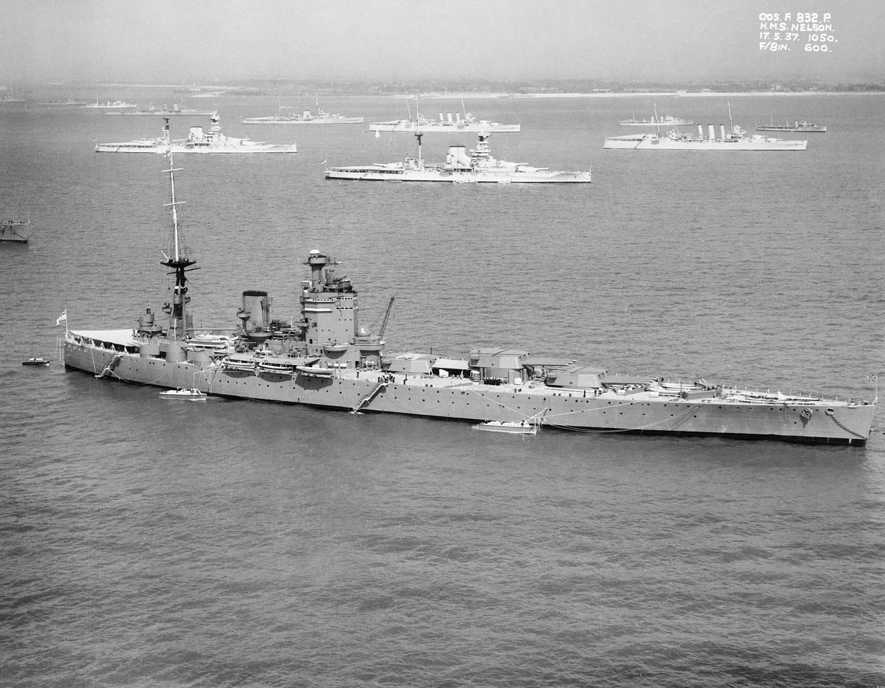 IWM caption : The British battleship HMS NELSON off Spithead for the 1937 Fleet Review. Anchored in the background are two Queen Elizabeth Class battleships and two cruisers of the London Class.