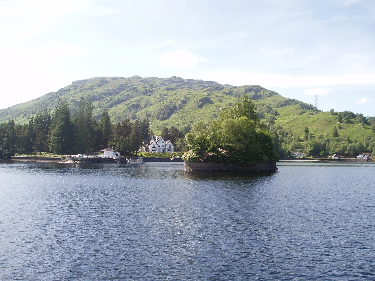 Sròn a' Chlachair / Stronachlachar seen from Loch Katrine with the Garradh in the background and Eilean a' Bhàillidh / Factor's Isle in the foreground.