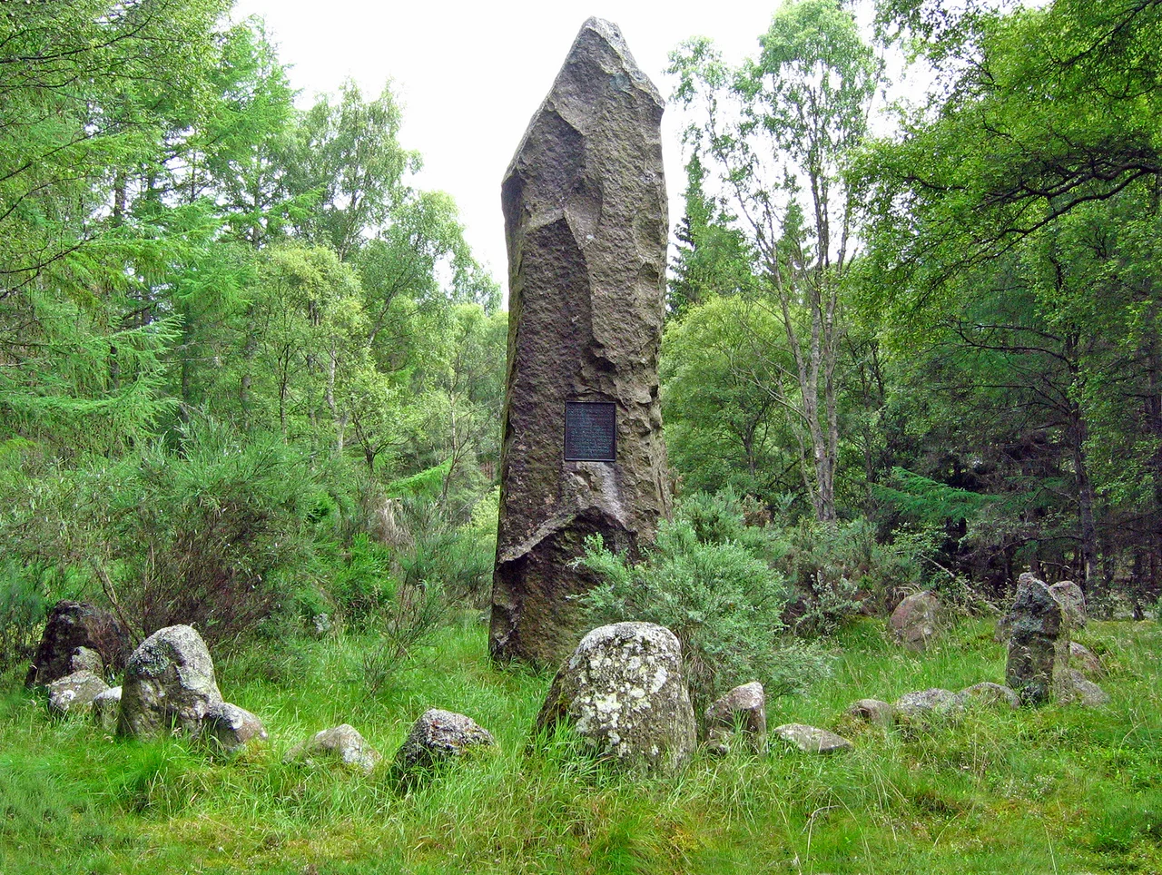 Corrichie Burn battle monument A view of the north face showing the stone circle surrounding the monument.