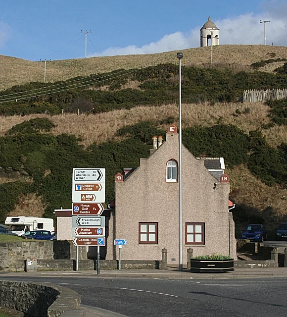 Bridgend At the apex of the gable is a red finial with the date 1877, and at the top of each wall is a similar finial, the one on the left reading 'RN' and the one on the right 'LBI'. I have yet to discover the significance of the building and the inscriptions. On the top of Doune Hill above it is the 'Temple of Venus', a belvedere designed by William Adam and built 1737-1743. It is a category 'B' listed building, and was restored in the 1980s.