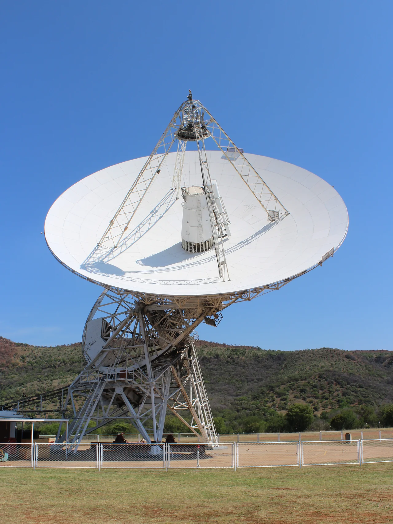 Front view of the 26 metre radio-telescope located at the Hartebeeshoek Radio Astronomy Observatory (HartRAO), formerly DSS 51 NASA Deep Space Station 51 located 65 km north-west of Johannesburg.  The telesscope has seven channels in the 1.3 cm to 18 cm range. It was built in 1961 as part of the NASA Space program and was handed over to the South African Council for Scientific and Industrial Research in 1975.[1]


↑ HartRAO 26m Radio Telescope Details. Retrieved on 2 December 2016.
